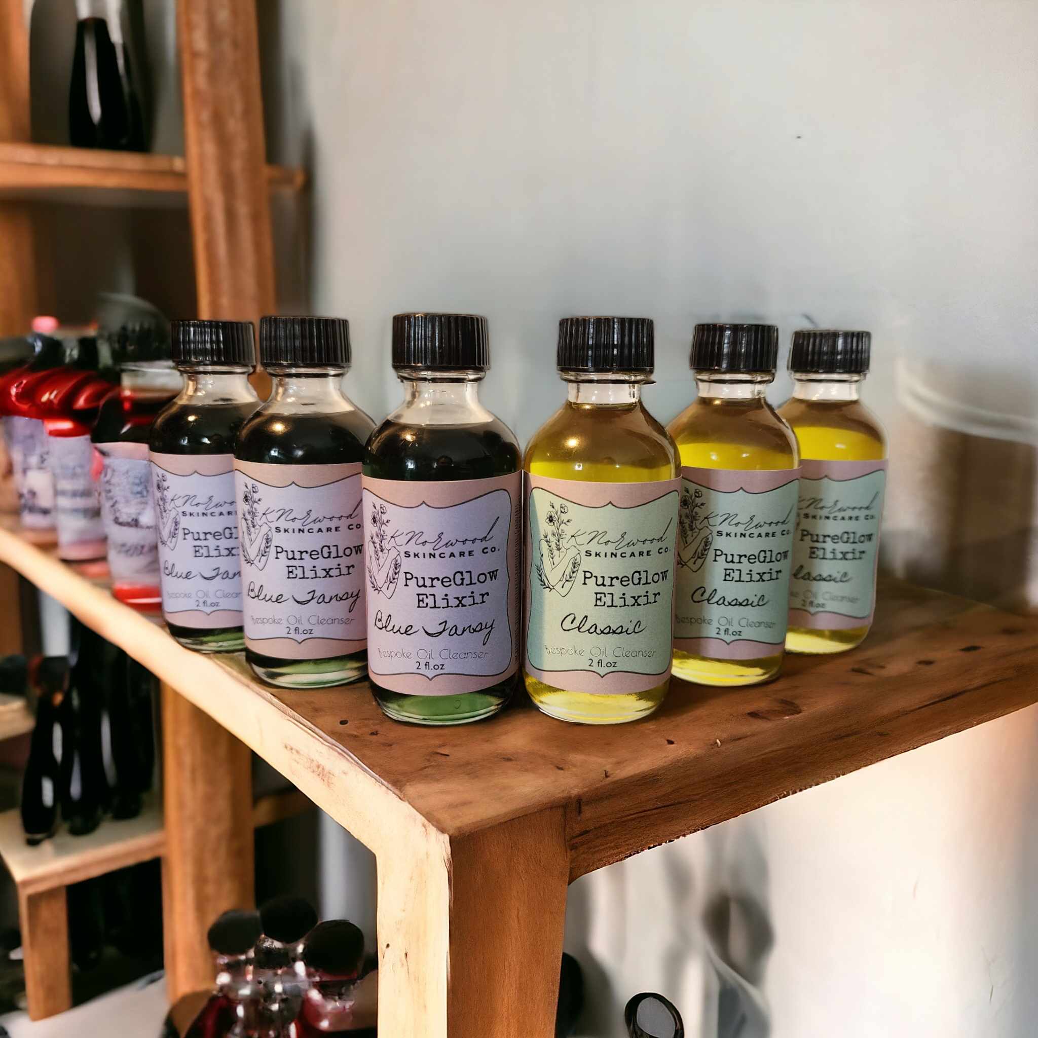 PureGlow Elixir Bottles sitting on a wooden shelf thumbnail